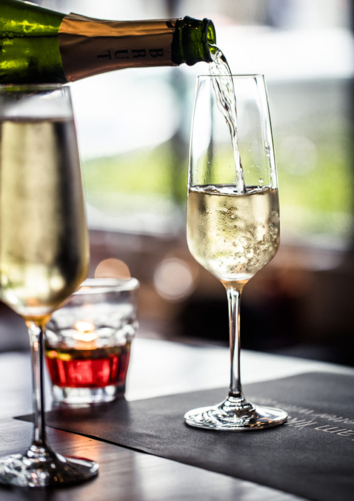 Pouring Brut Champagne in a glass